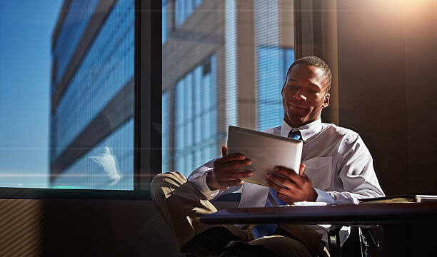 Shot of a businessman using his digital tablet at his desk
